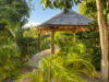 Tropical garden gazebo at St Barts villa surrounded by lush greenery