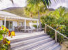 Terrace with outdoor dining and sun loungers at a beachfront St Barts villa rental