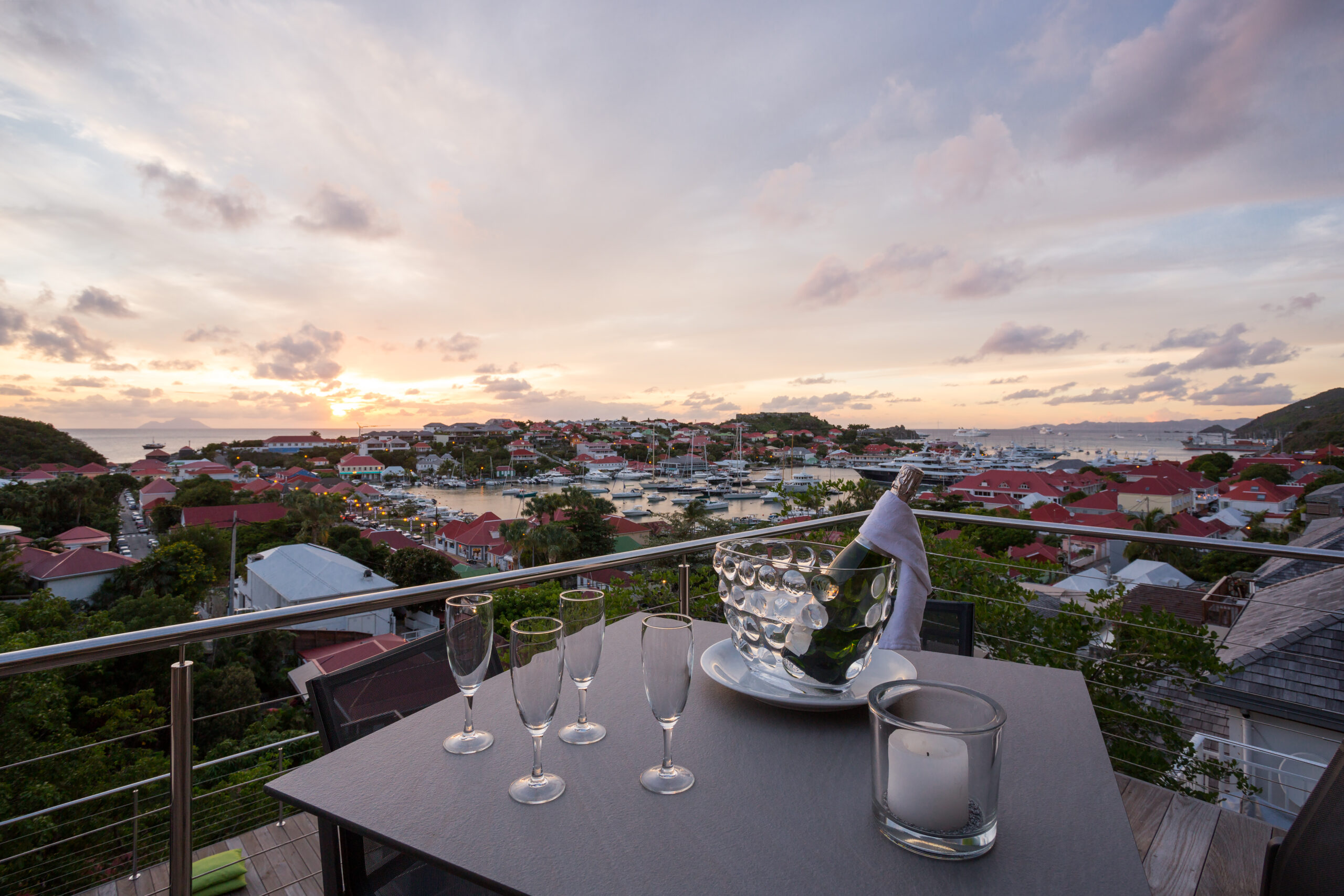 Lounge area on a terrace with comfortable seating and a beautiful view of the surrounding landscape