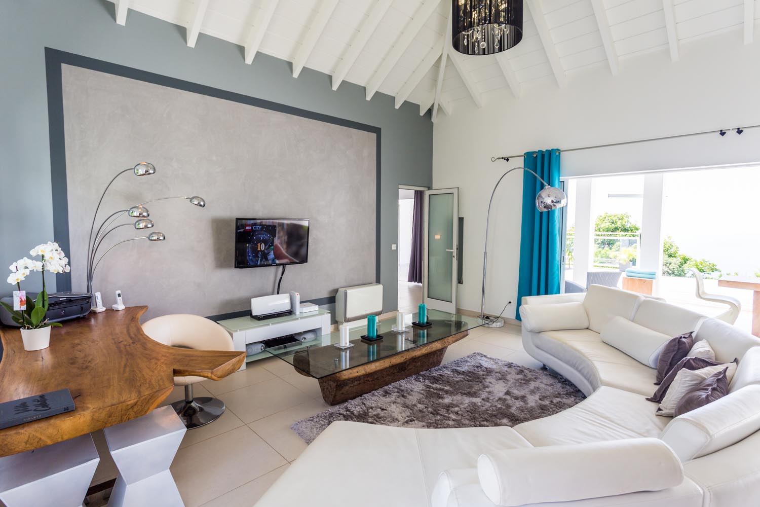 Stylish living room in St Barts villas with vaulted ceiling and contemporary decor