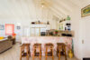 Kitchen bar in St Barthelemy vacation rentals with stone counter and wooden stools
