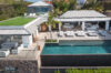 Aerial view of luxury St Barts villa with infinity pool, sun deck, and modern design