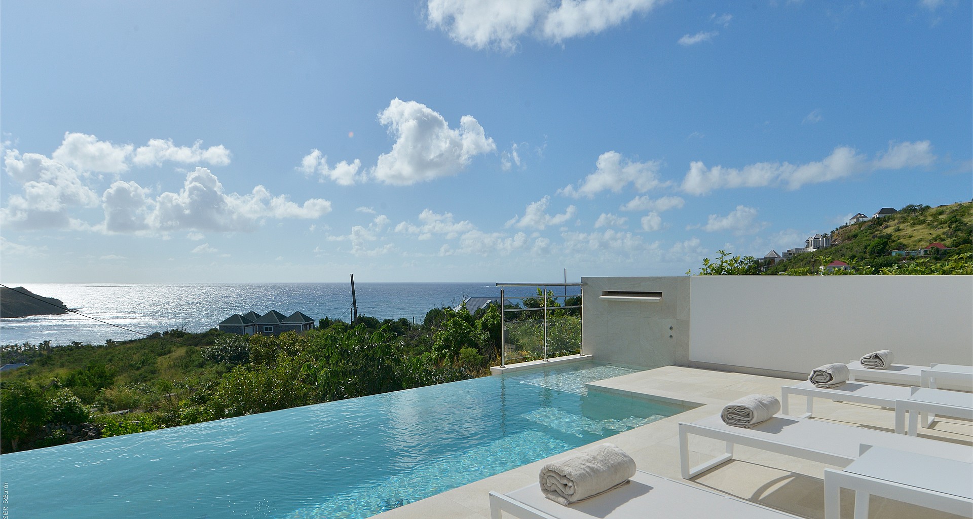 Infinity pool with panoramic ocean views and sun loungers at a luxury villa in St Barths.”