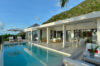 Contemporary villa with shaded dining terraces and infinity pool overlooking the hills in St Barts.