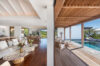 Seamless indoor-outdoor living at St Barts villa with lounge, dining area, and poolside terrace