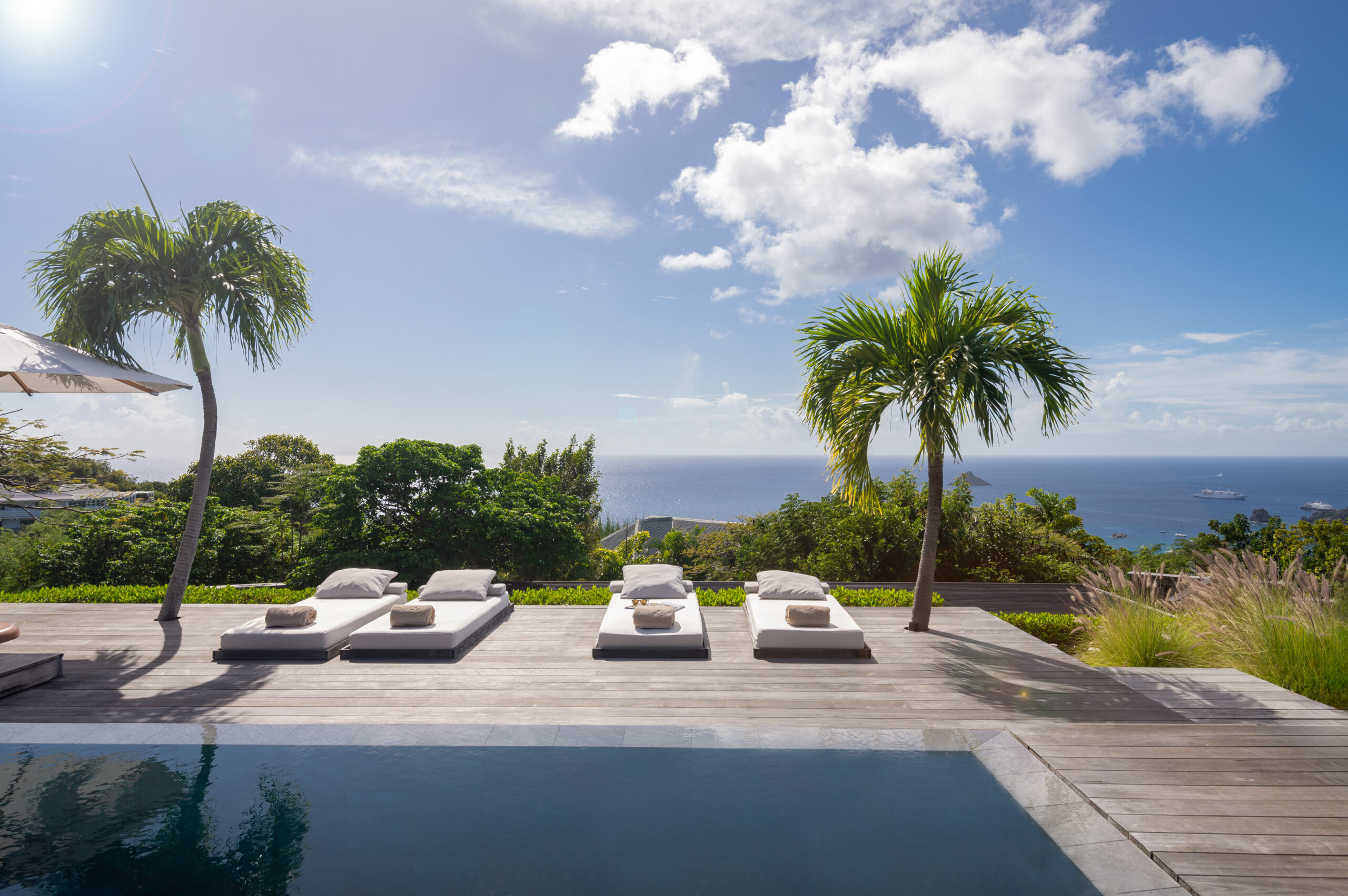 The outdoor deck at Villa Viewing Deck in St. Barts offers stunning sea views.