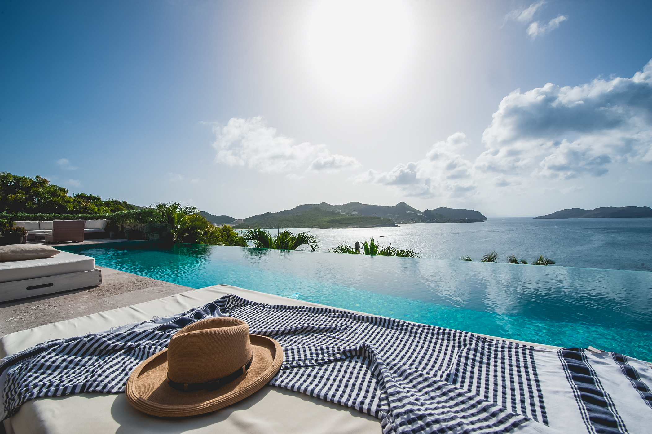 Luxury villa terrace in St Barts with infinity pool overlooking the Caribbean Sea.