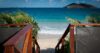 Private villa rental in St Barts with direct wooden stairway access to white sand beach and turquoise sea.
