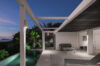 Modern terrace with lounge seating and illuminated pool at private villa rental in St Barts