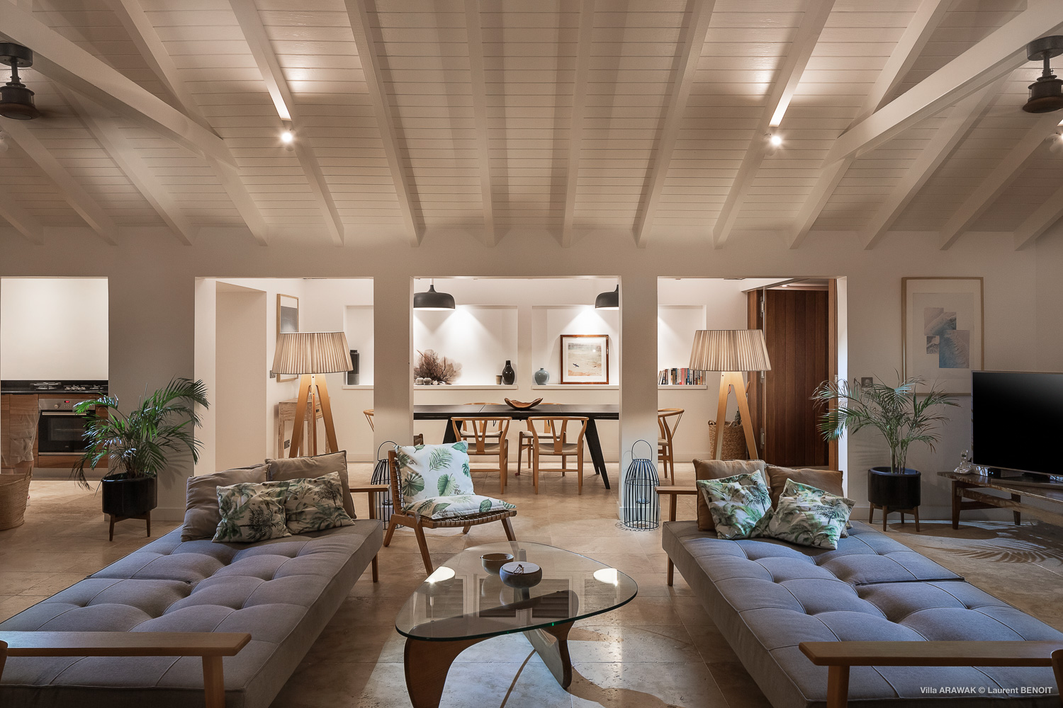 Spacious living room with chaise lounges and vaulted ceiling at luxury villa in St Barts