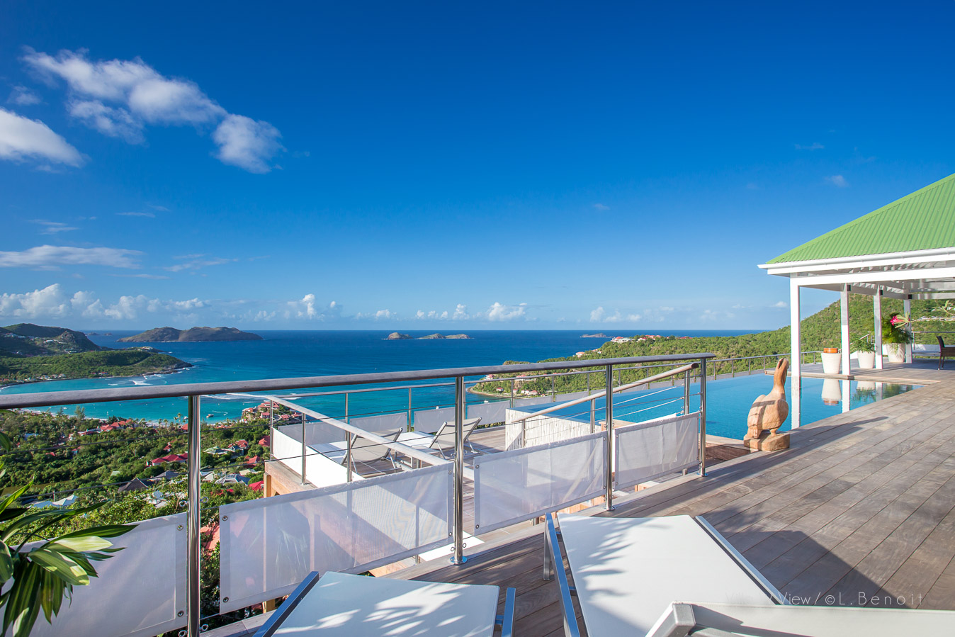 Terrace at a luxury villa in St Barts with loungers and sweeping Caribbean Sea views.