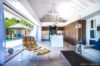 Contemporary living space in a St Barts villa with open design, pool views and modern furnishings
