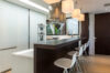 Sleek kitchen bar in luxury villas St Barts with pendant lighting and modern stools