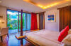 Contemporary bedroom with balcony access and tropical garden view at St Barts villa rental