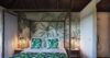 Tropical-inspired bedroom with canopy bed and botanical décor at a luxury villa in St Barts