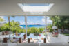 Contemporary living room with ocean view and vibrant décor at a luxury St Barts villa rental