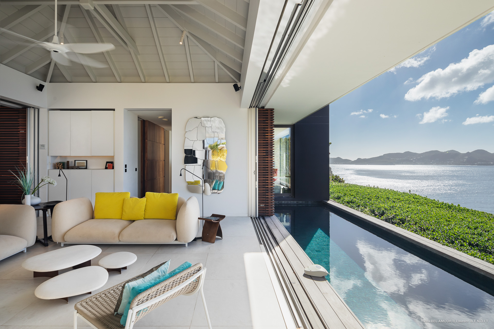 Modern living area in a St Barts villa with infinity pool and panoramic sea views