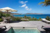 Deckside plunge pool with sun loungers, dining table, and panoramic Caribbean Sea views in a St Barts villa rental.