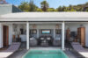 Private villa in St Barts with plunge pool, shaded outdoor lounge, and tropical hillside backdrop.