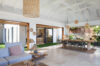 Stylish open-plan living and dining area with natural accents at a luxury villa in St Barts