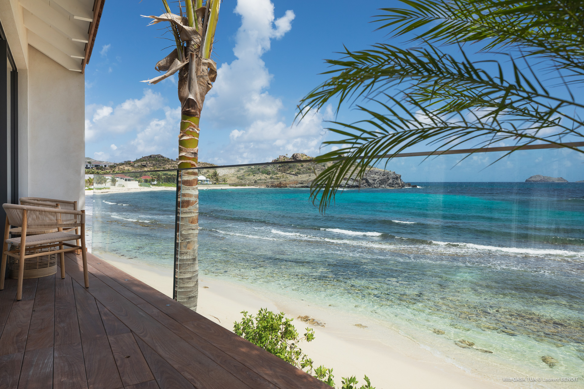 Beachfront terrace with wooden deck and ocean views at a private villa in St Barts