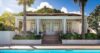 Elegant white villa with shaded terrace, tropical garden, and pool in St Barts vacation rental