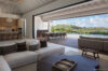 Spacious open-plan living room with kitchen and terrace dining area at a luxury villa in St Barts