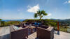 Terrace lounge at St Barts villa rentals with panoramic ocean and hillside views