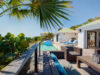 Poolside deck in luxury villas St Barts with lounge seating and tropical views