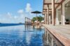 Stunning seafront infinity pool at a St. Barts villa, featuring loungers and breathtaking Caribbean panoramas.