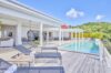 Sun terrace of vacation rentals St Barts with loungers beside infinity pool