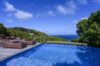Infinity pool of St Barts villa hire with sun loungers and ocean views