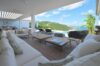 Open-air lounge with white sofas and panoramic ocean views at luxury villa in St Barts