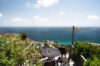 cenic terrace with wrought-iron table and panoramic ocean views at St Barts villa rental