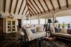Elegant living room in St Barts luxury rentals with vaulted ceiling and ocean views