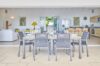Outdoor dining area of St Barths villas opening to spacious kitchen and lounge
