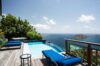 pool with blue loungers and panoramic hillside ocean view at St Barthelemy villa rental