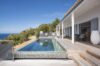 Infinity pool at luxury St Barts villa with ocean views and sunlit terrace