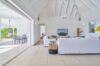 Bright living room in villa a Saint Barth with vaulted ceiling and terrace access