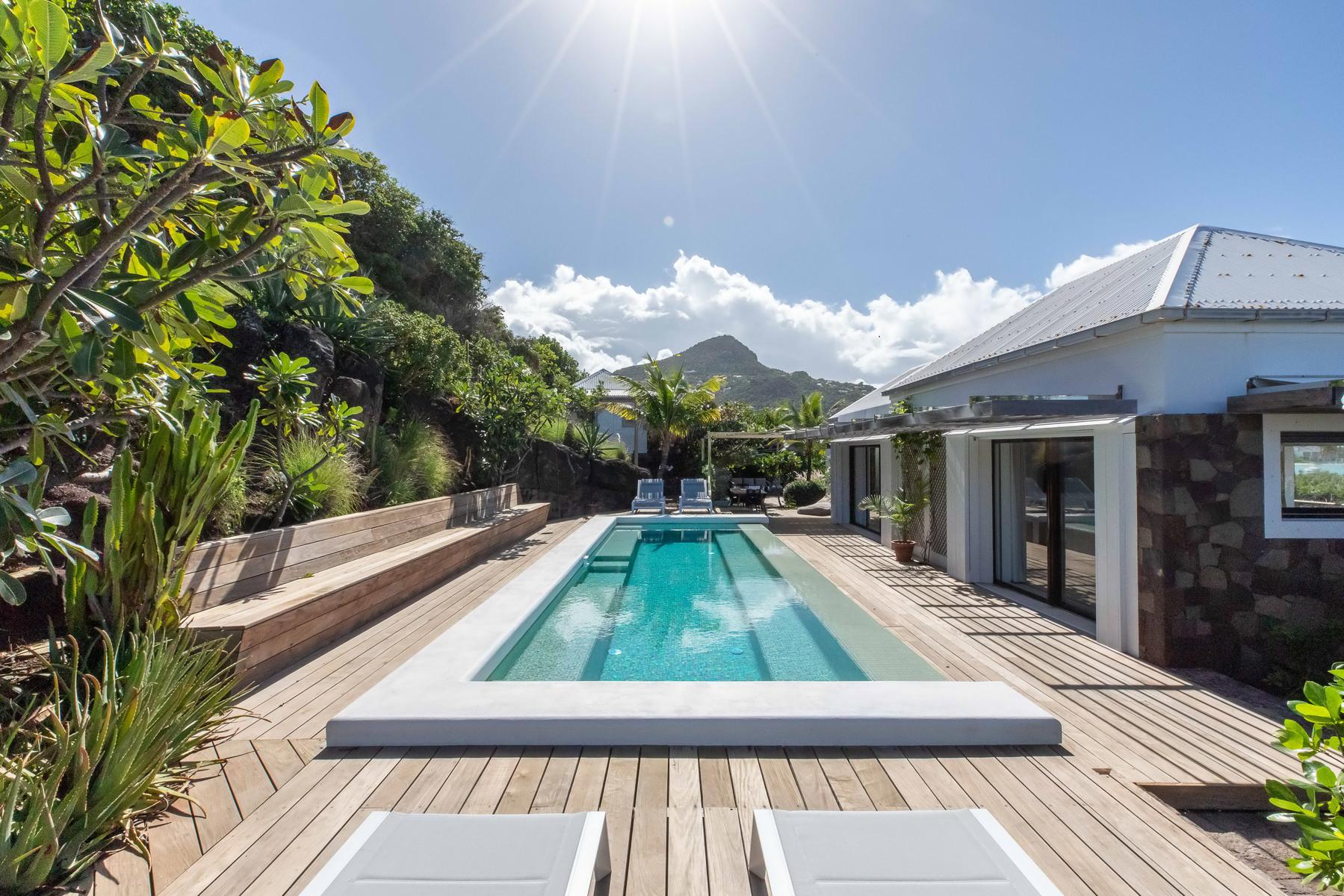 Beautiful pool nestled within lush natural surroundings, creating a serene oasis.