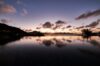 Infinity pool at St Barts villa reflecting sunset skies over Caribbean horizon