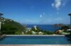 Infinity pool with panoramic hillside and ocean views from a St Barts luxury villa rental