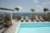 Stone terrace pool at St Barths villa hire with sun loungers and tropical plants