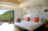 Bedroom with balcony and hillside view in a modern St Barts villa rental