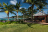 Seaside villa garden in St Barts with palm trees, open-air pavilion, and sweeping Caribbean views