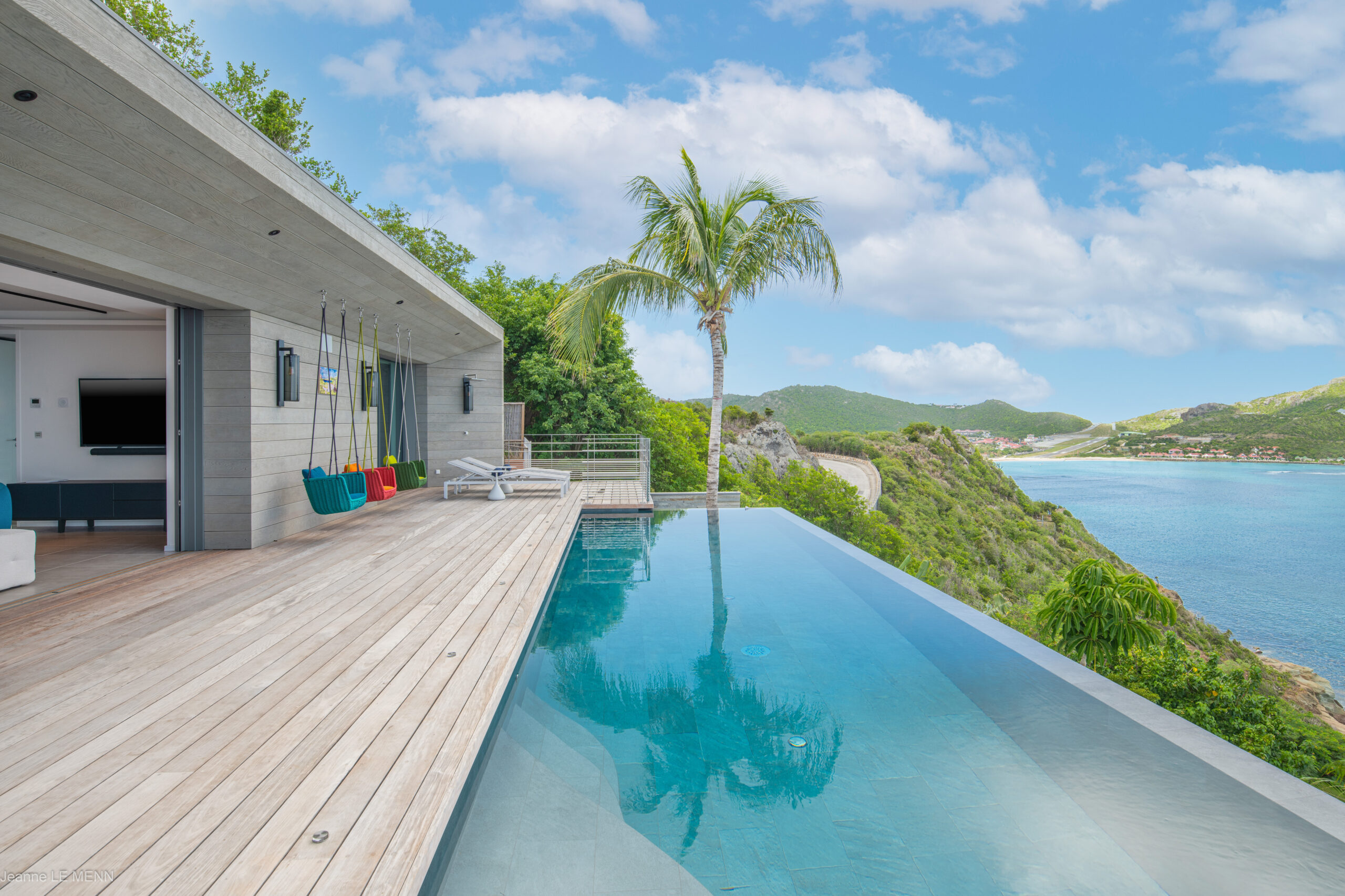 Pool view of Villa Jeanne, St Barts, blending sea, sky, and tropical air.