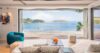 Modern St Barts villa living room with open design, plush sofas, and ocean views through wide glass windows.