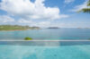 Luxury infinity pool at a St Barts villa with sun terrace and sweeping ocean horizon views.