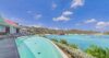 Luxury St Barts villa infinity pool with sweeping Caribbean Sea views and sunlit terrace.