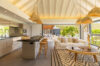 Open kitchen and living room with natural light and modern design in a St Barts villa rental